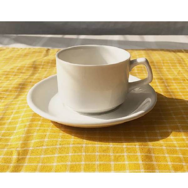 Thick and durable white ceramic coffee cup with convenient design with support plate below